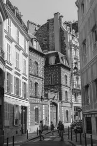 People walking on street in city