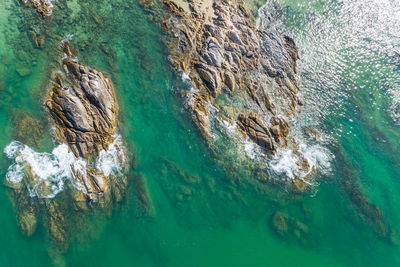 High angle view of rock formation in sea