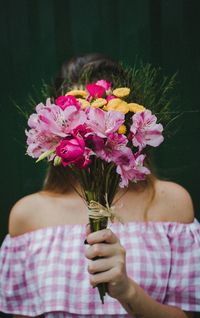 Close-up of woman holding bouquet