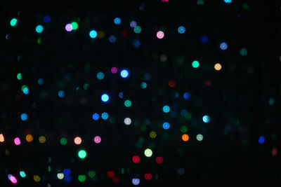 Defocused image of illuminated lights at night