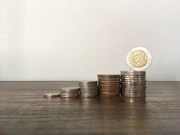 Stack of coins on table