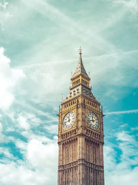 Low angle view of clock tower against sky
