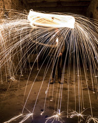 Close-up of illuminated lighting equipment at night