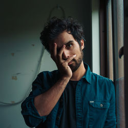 Portrait of young man looking at camera
