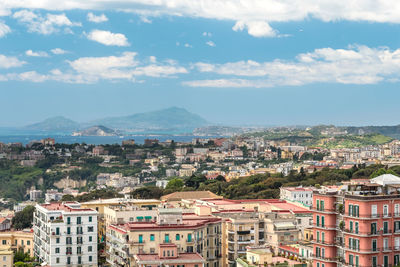 Aerial view of cityscape against sky