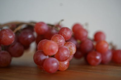 Close-up of grapes on table