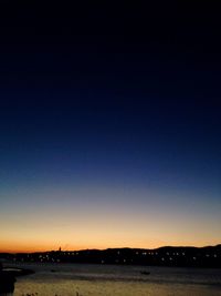 Scenic view of beach against sky at night