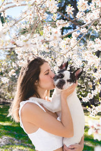 Side view of woman with dog