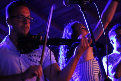 Portrait of young man and woman at music concert