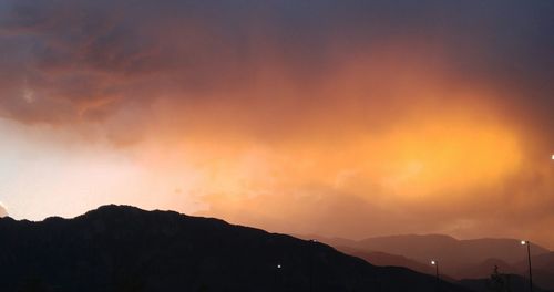 Low angle view of silhouette mountain against sky during sunset