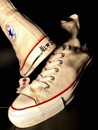 Low section of person wearing canvas shoes