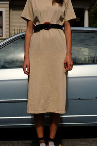 Rear view of couple standing in car