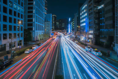 High angle view of light trails on road at night