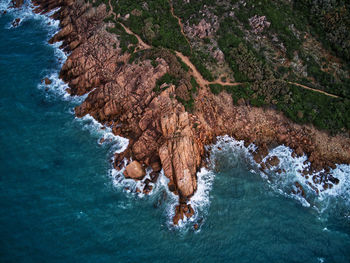 High angle view of rocks in sea