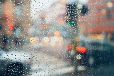 Raindrops on glass window during rainy season