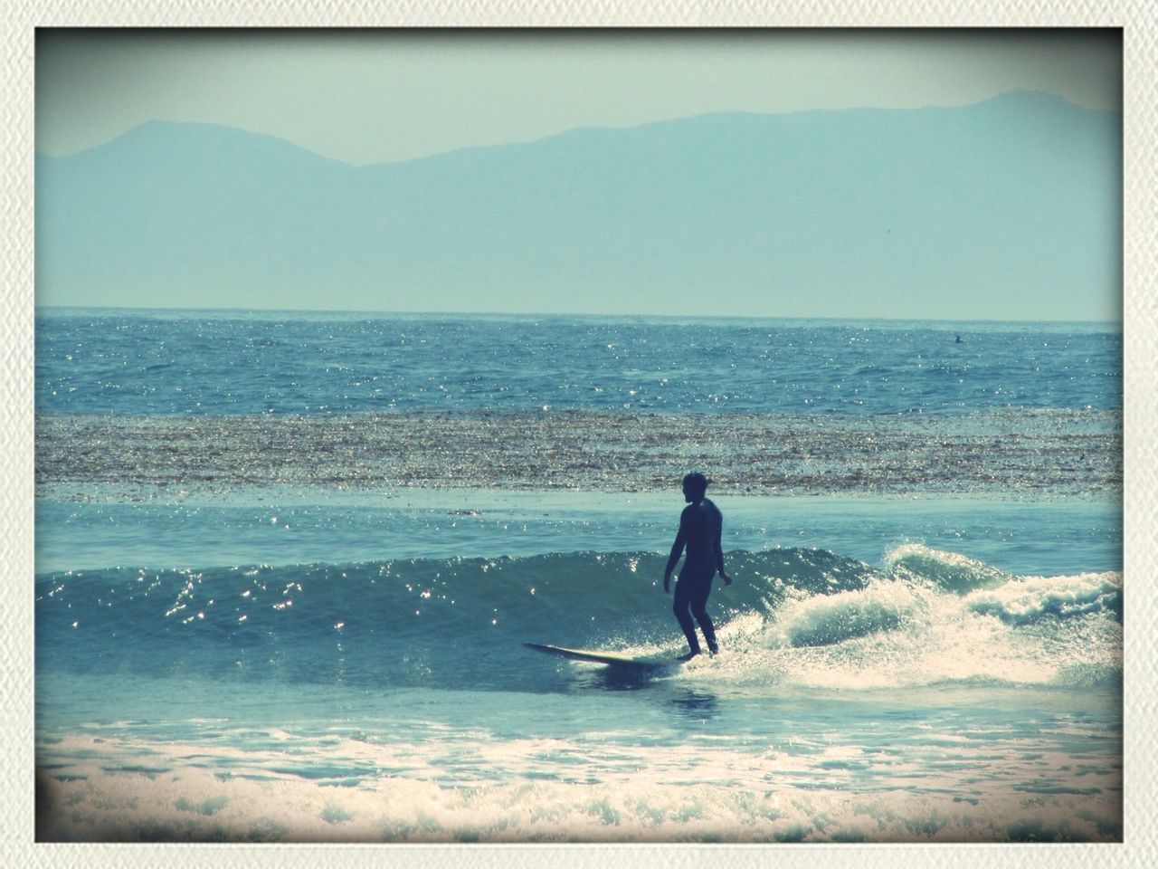 sea, water, horizon over water, transfer print, beach, full length, auto post production filter, leisure activity, shore, lifestyles, wave, sky, men, scenics, rear view, beauty in nature, tranquil scene, tranquility