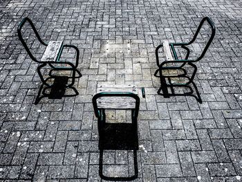 High angle view of empty chairs on street