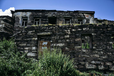 Low angle view of old building against sky