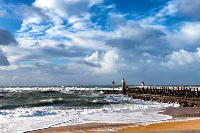 Scenic view of beach against sky