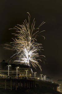 Firework display at night