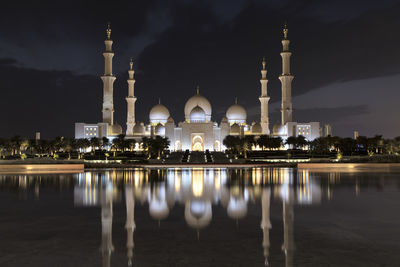 Reflection of illuminated buildings in water at night