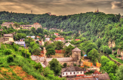 High angle view of trees and buildings against sky