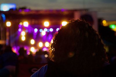 Rear view of woman at music festival