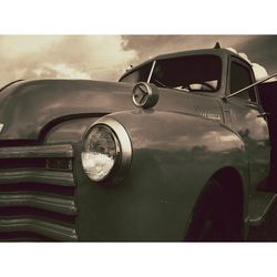 Close-up of car on road