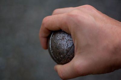Cropped image of man holding ball