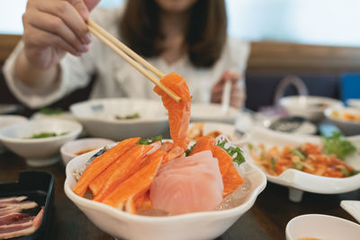 Midsection of woman having food