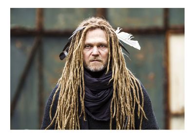 Portrait of serious mature man with dreadlocks