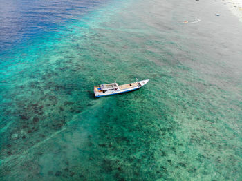 High angle view of ship sailing in sea