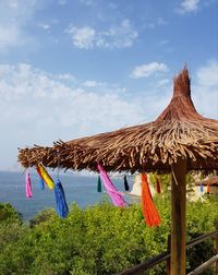 Clothes drying on roof against sky