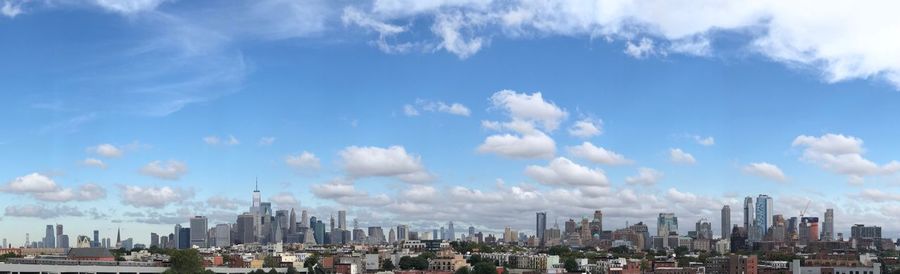 Panoramic view of modern buildings against sky