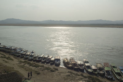 High angle view of boats moored on shore