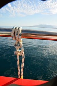 Close-up of boat in sea against sky