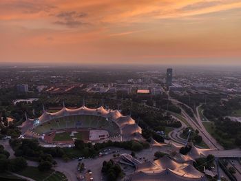 High angle view of buildings in city during sunset