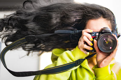 Woman photographing with camera