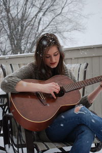 Young woman playing guitar