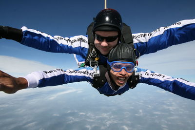 Portrait of men skydiving