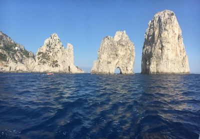 Panoramic view of sea against clear blue sky