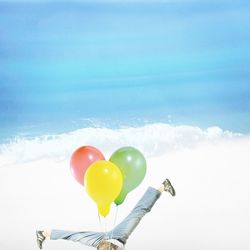 Close-up of heart shape balloon against sky