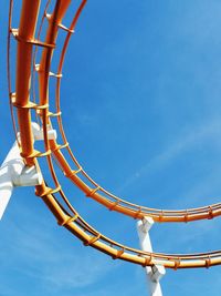 Low angle view of rollercoaster against sky