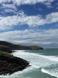 Scenic view of sea against cloudy sky