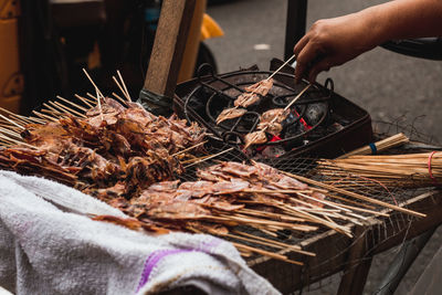 Cropped hand of person preparing food