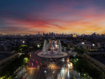 High angle view of illuminated buildings against sky during sunset
