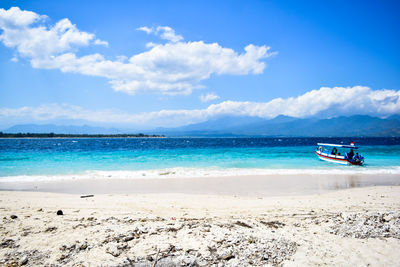 Scenic view of sea against blue sky