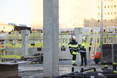 Construction engineers working at construction site