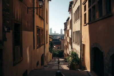 Narrow street amidst buildings in town