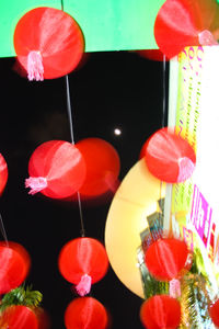 Low angle view of lanterns hanging at night